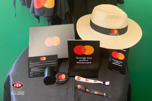 Branded promotional products displayed at a trade show, showcasing how custom merchandise boosts exhibition branding.