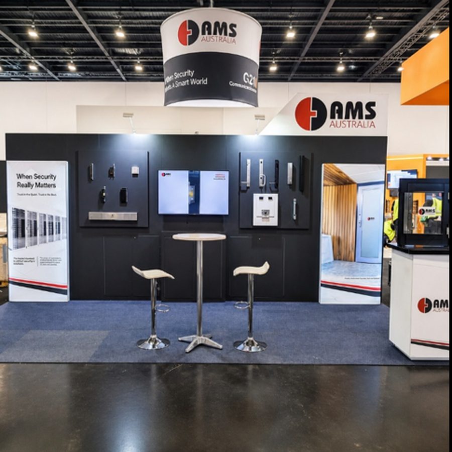 AMS Australia exhibition stand with product wall and hanging sign